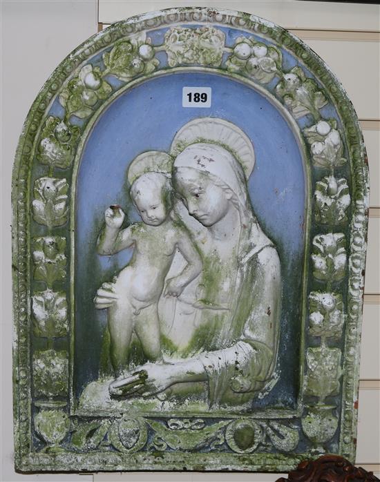 A painted terracotta wall plaque, mother & child